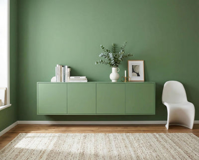 Re-Box Wandfarbe Green Husk No. 10 – ruhig gestrichene Wand in natürlichem Grünton, harmonische Innenraumgestaltung mit moderner Möbelintegration